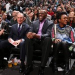 Current Mayor of New York City Michael Bloomberg sits with NBA legend Earvin "Magic" Johnson